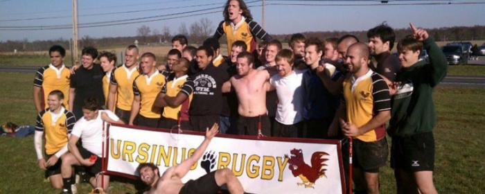 Ursinus College Rugby team with banner