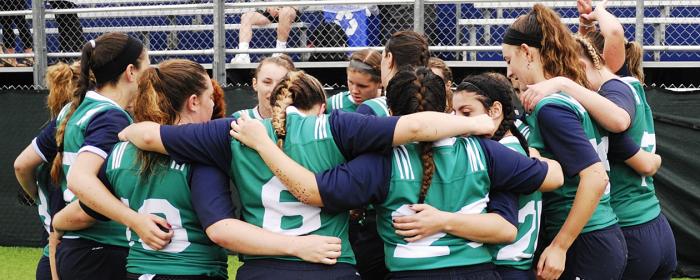 Endicott College Women 7s huddle at the half