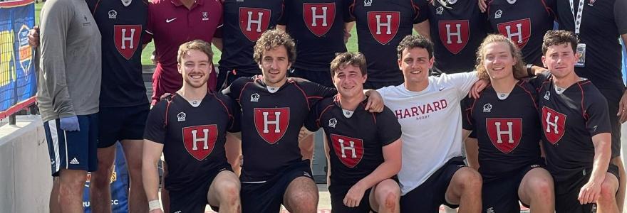 team under banner at the collegiate championships