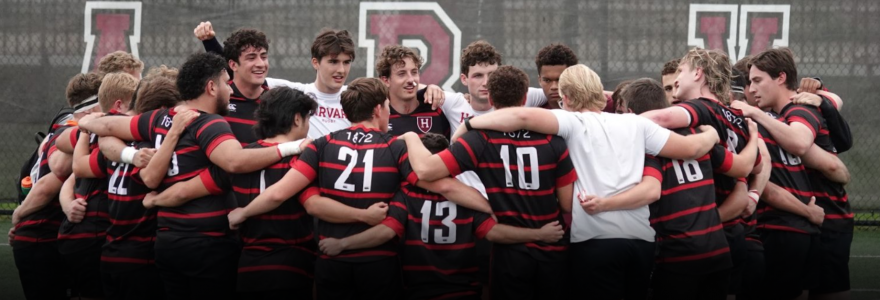 men's team huddles on the field