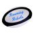 blue script on a black and white rugby ball